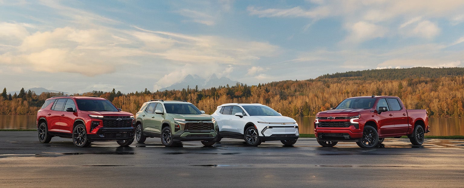 Lineup of four Chevrolet vehicles parked outdoors